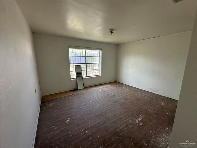 Unfurnished room with dark hardwood / wood-style floors | Image 17