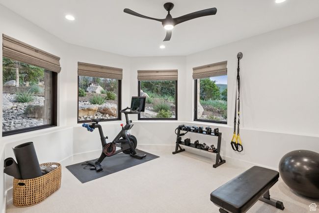 Exercise room with a ceiling fan, recessed lighting, and carpet floors | Image 61