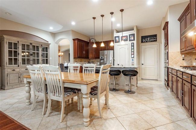 Another view of the breakfast area and open concept design to the kitchen. | Image 28
