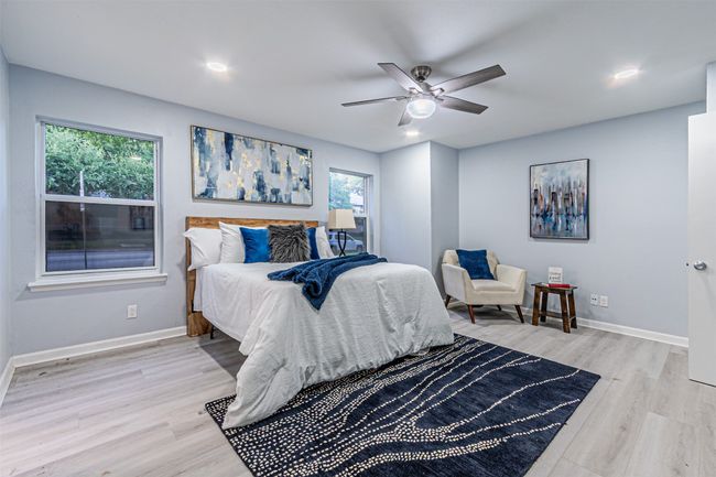 Bedroom featuring light wood-style floors, recessed lighting, baseboards, and ceiling fan | Image 12