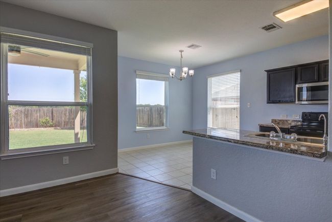 Just another view of the open floor plan. You could easily add a couple of bar stools right there. | Image 16