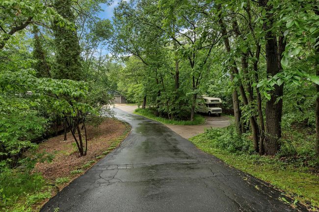 Extra parking off the the driveway to keep your toys | Image 52