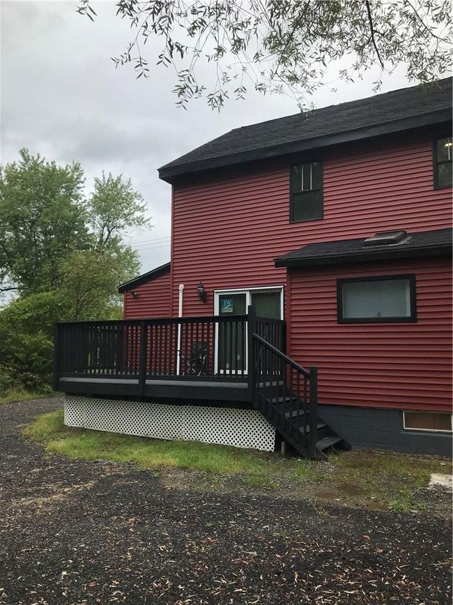 Rear view of house with a deck | Image 12