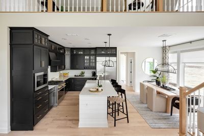 View from your Great Room into your Kitchen and Dining Area. Pics are of actual model home and are representative only. | Image 3