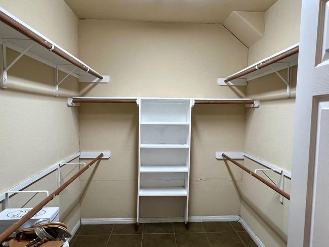 Walk in closet with tile patterned flooring | Image 11