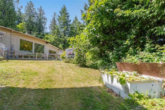 View of yard featuring a garden | Image 69