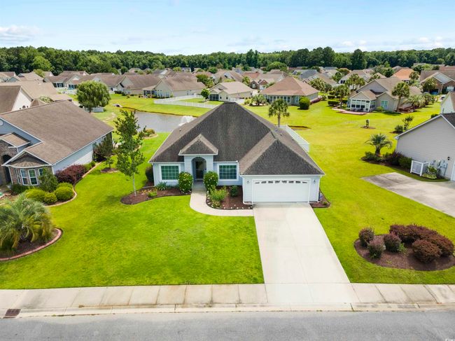 Aerial view of residential area with a large body of water | Image 17