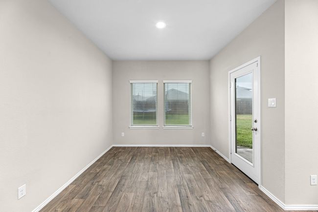 Back inside another view of your kitchen eating area with views of the backyard. | Image 24