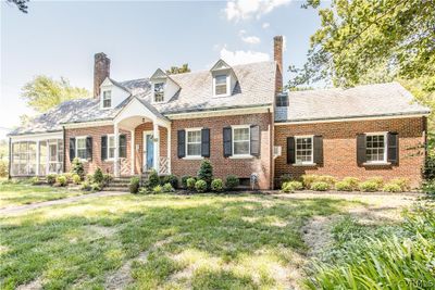 New england style home featuring a front lawn | Image 2