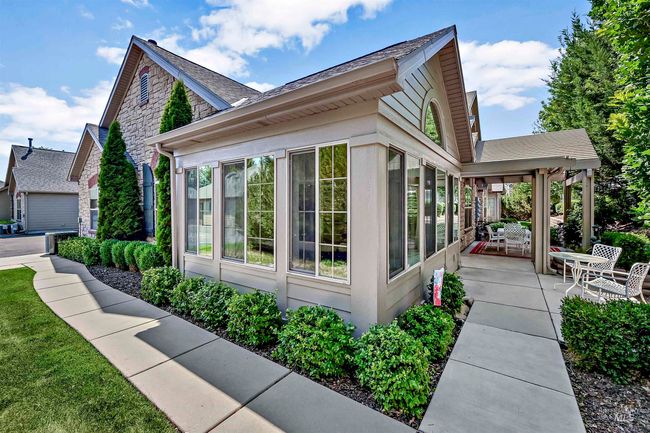 View of home's exterior featuring a sunroom | Image 17