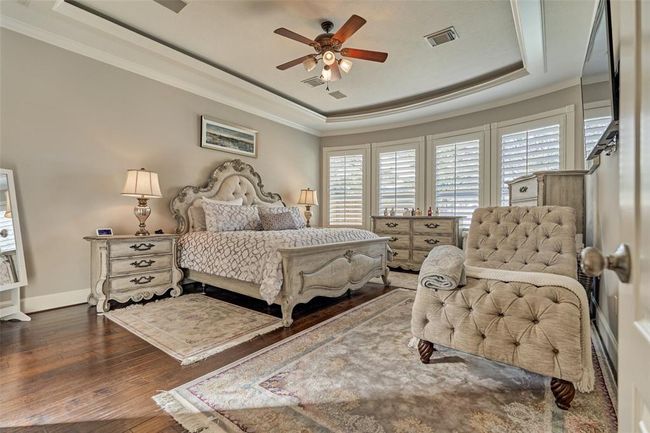 Wake up to stunning backyard views in this spacious primary bedroom, your perfect relaxing retreat. | Image 14