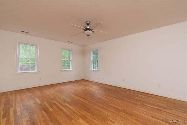 Primary bedroom with beautiful hardwood floors, walk-in closet and ensuite bath | Image 28