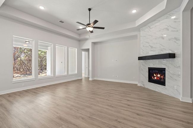 Family Room with tray ceiling & fireplace | Image 14