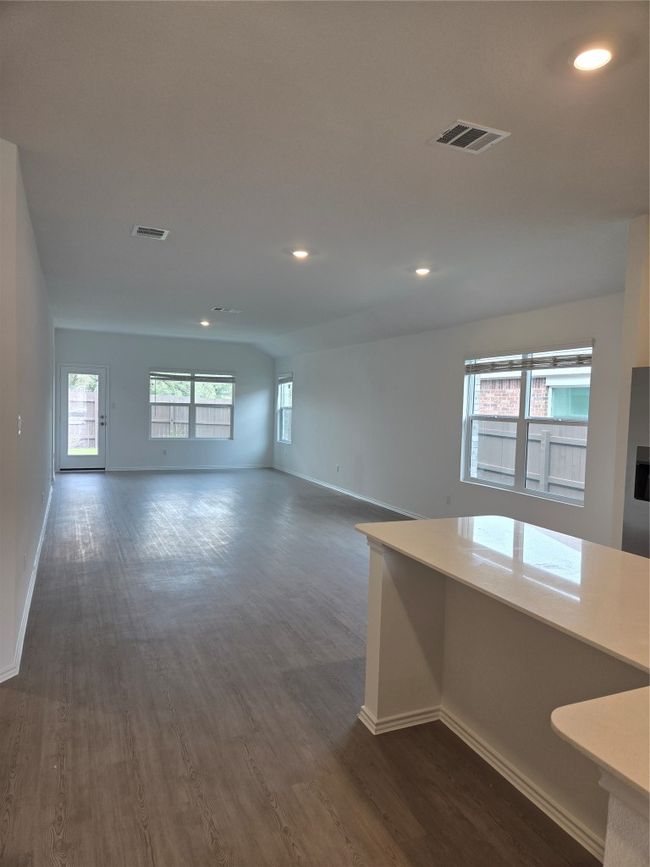 Empty room featuring dark wood finished floors and recessed lighting | Image 7