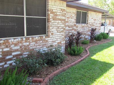 Landscaping along the front of the house | Image 3