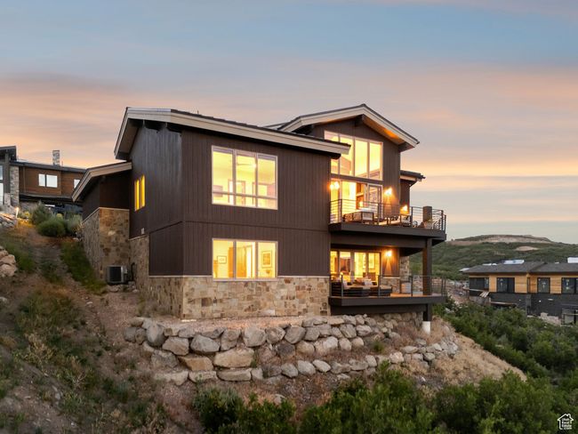 View of front facade featuring a balcony and stone siding | Image 66