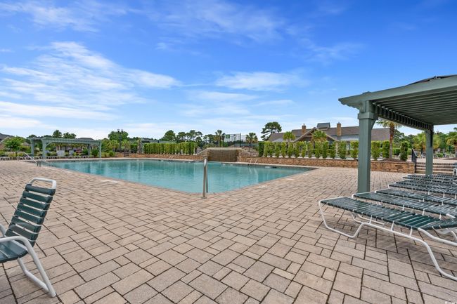 Community pool featuring a pergola and a patio | Image 14