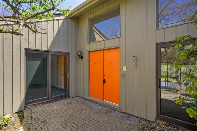View of exterior entry with a patio area | Image 42