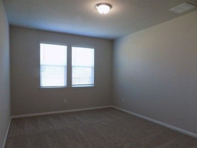 Spare room with carpet flooring and baseboards | Image 14
