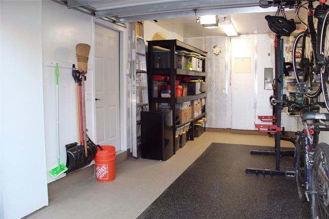 Garage featuring a garage door opener | Image 20
