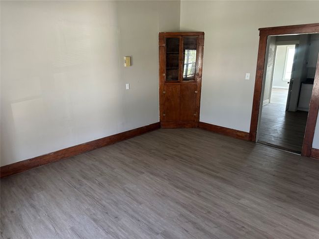 Empty room featuring baseboards and wood finished floors | Image 14