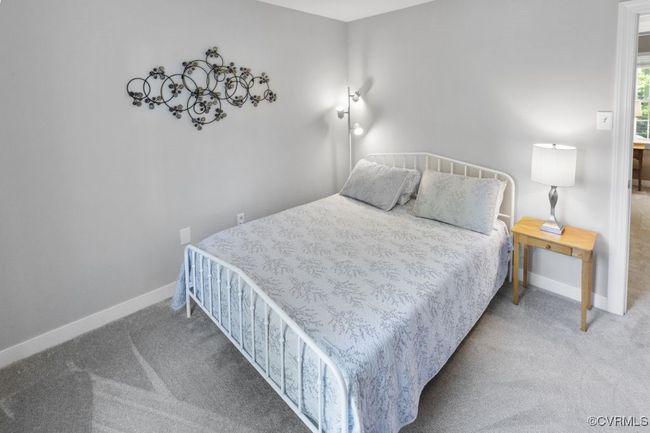Carpeted bedroom featuring baseboards | Image 33