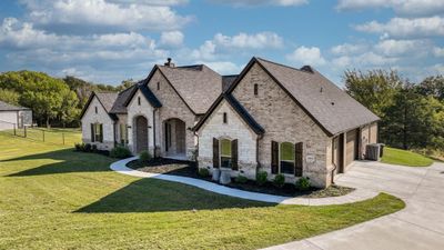 View of front of home with a garage and a front lawn | Image 3