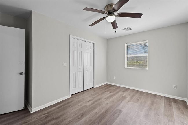 The primary has a window facing the backyard. | Image 11