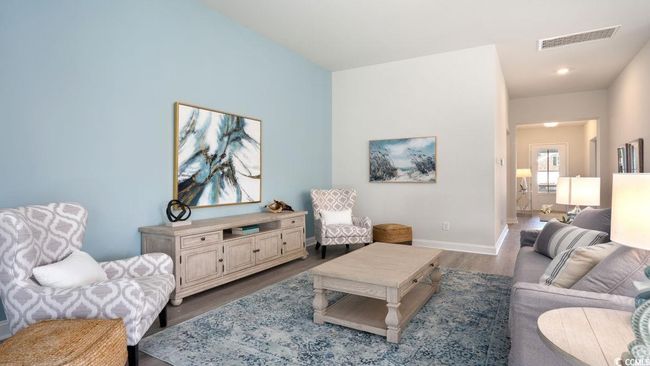 Living area featuring dark wood-style flooring and baseboards | Image 13
