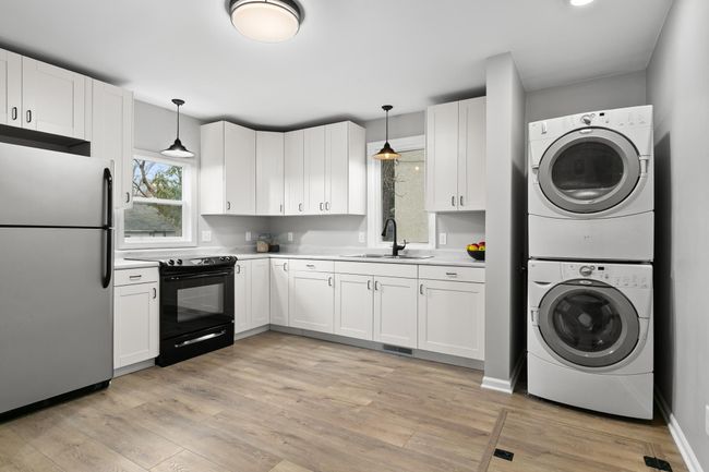 There is an abundance of cabinet and countertop space in this kitchen. | Image 6