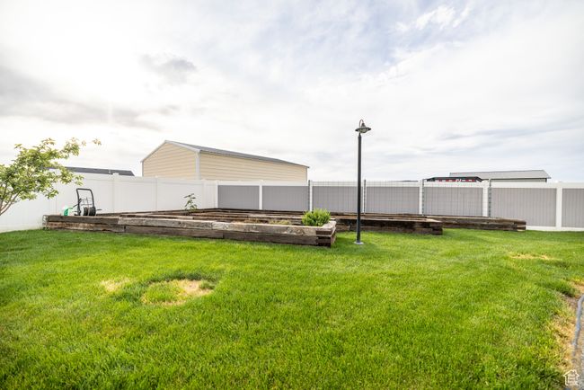 View of yard featuring a garden | Image 75