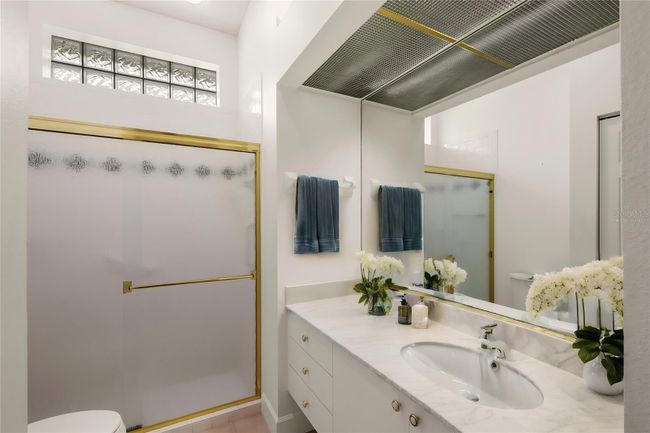 virtually staged guest bath | Image 25