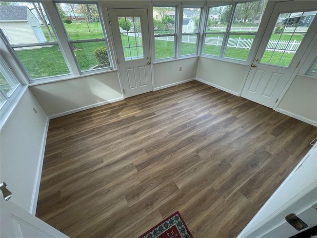 View of unfurnished sunroom | Image 38