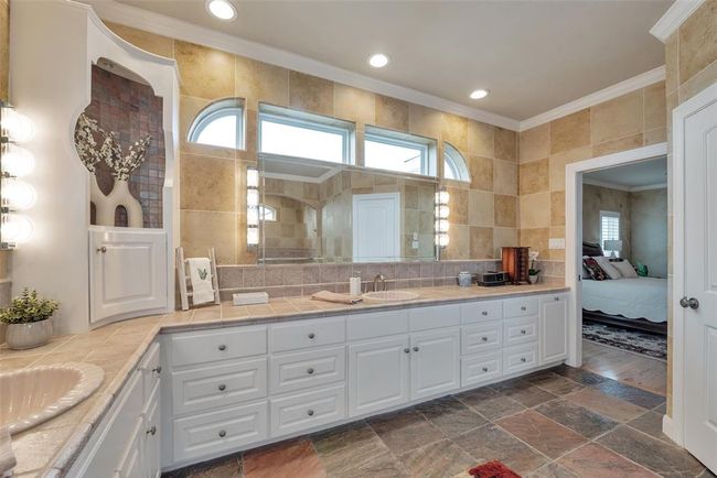 Huge primary bathroom with plenty of storage. | Image 38
