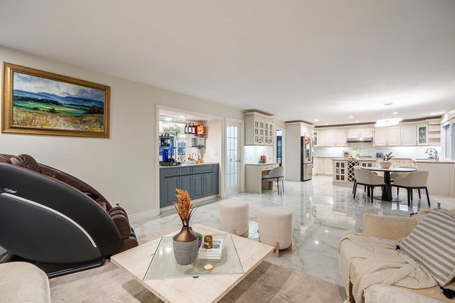 Living area with recessed lighting and light marble finish flooring | Image 15