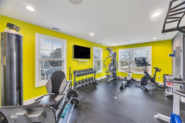 Exercise room with visible vents, a healthy amount of sunlight, and recessed lighting | Image 39