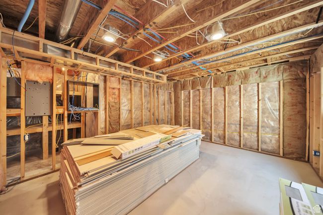 View of unfinished room, with sheetrock & LVP flooring provided. | Image 28
