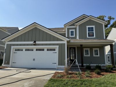 This new home backs to a tree line and is located in close proximity to the community pool. | Image 2