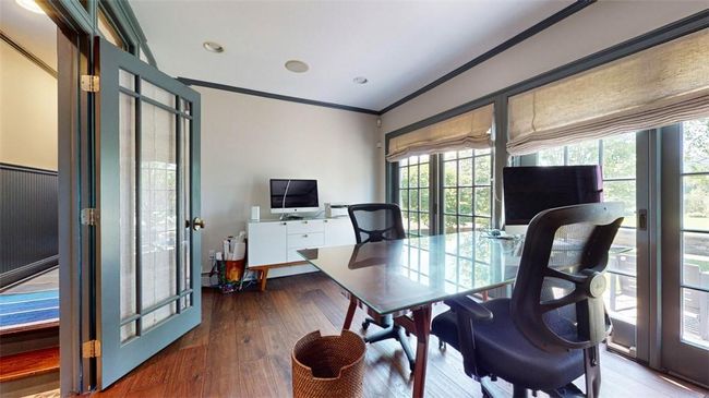 Office space with built in cabinets and shelving and French doors | Image 16