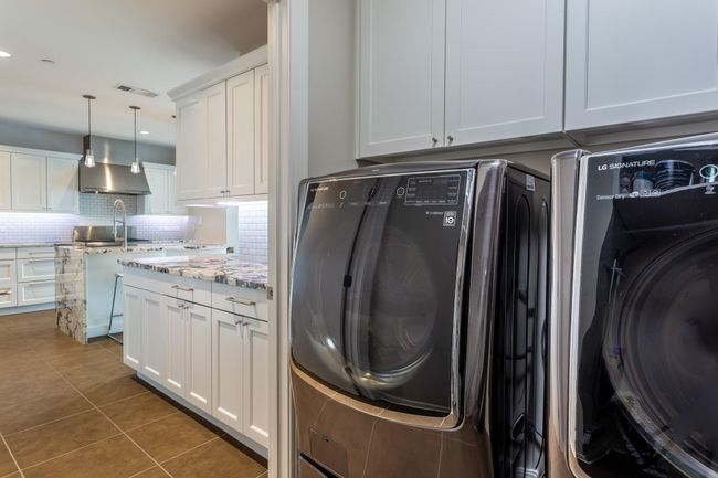 Laundry with sink off of kitchen. | Image 19