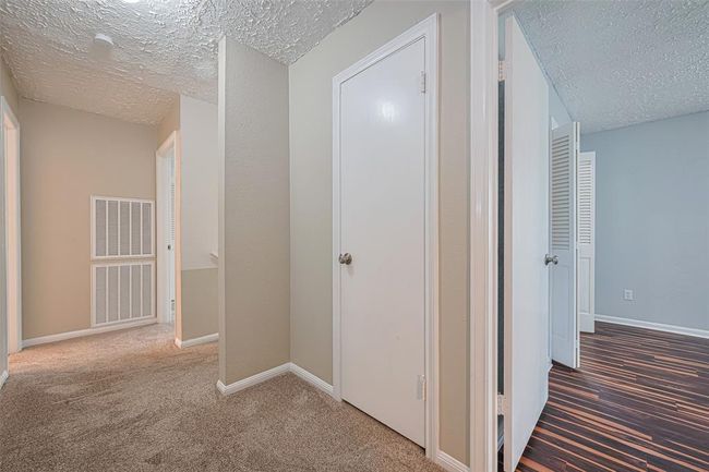 Hallway upstairs has so much storage | Image 35