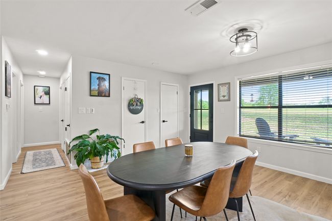 Dining space with light wood-style flooring and recessed lighting | Image 12