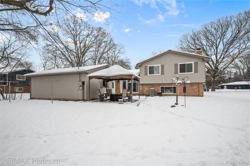 839 Harlequin Ct, Highland, MI, 48357-3929 | Card Image