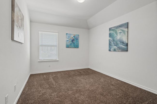 Bedroom #4 on second floor with carpet and baseboards vaulted ceiling, and walk in Closet | Image 28