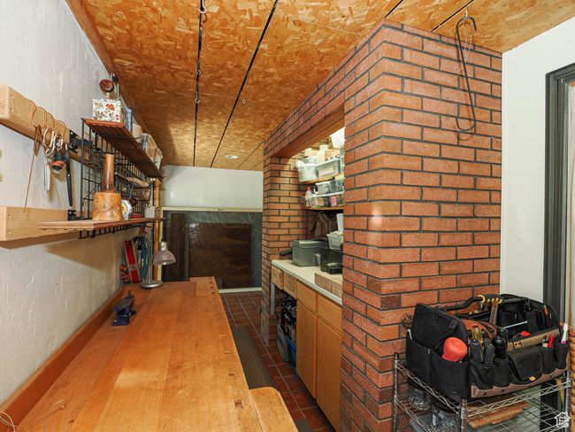Kitchen featuring wood counters and open shelves | Image 55