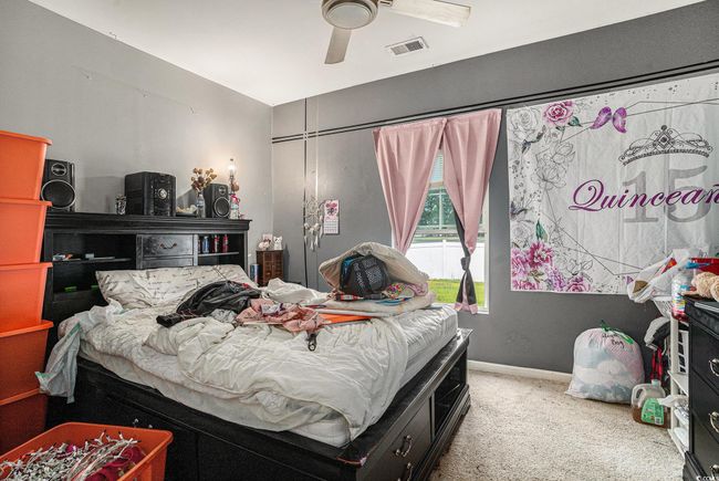 Bedroom with carpet, a ceiling fan, and baseboards | Image 22