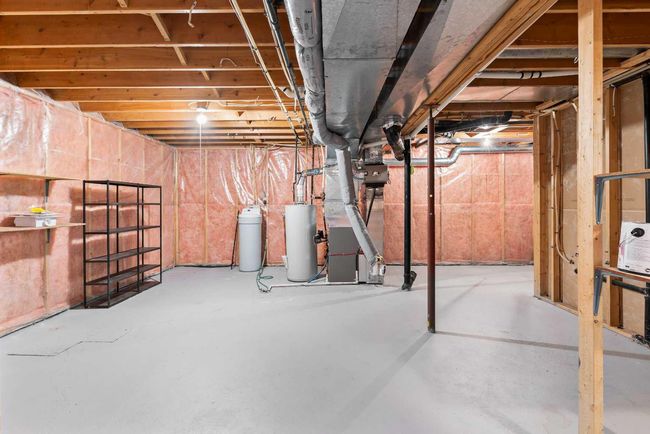 1038 Shawnee Rd Sw, Home with 3 bedrooms, 3 bathrooms and 4 parking in Calgary AB | Image 35
