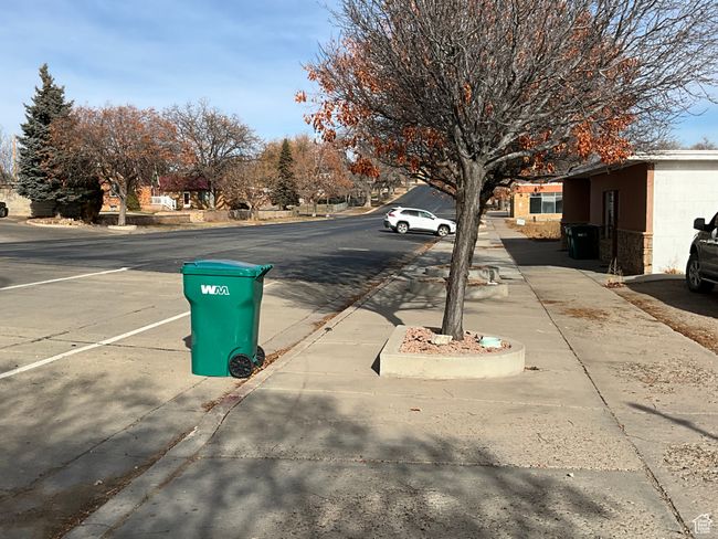 View of street featuring sidewalks and curbs | Image 8