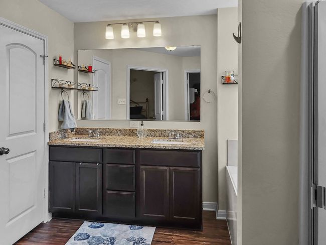 Bathroom featuring wood finished floors and double vanity | Image 18