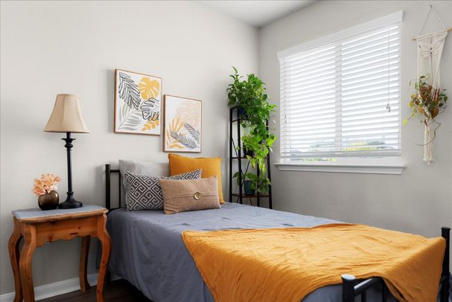 Bedroom featuring baseboards and wood finished floors | Image 23